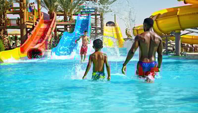 Families enjoying a day at a Dubai water park Families enjoying a day at a Dubai water park